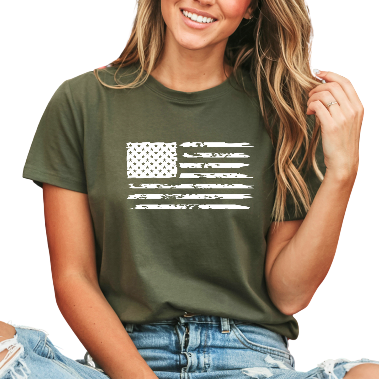 Child wearing a black sweatshirt with 'USA Est. 1776' design, sitting on a couch.