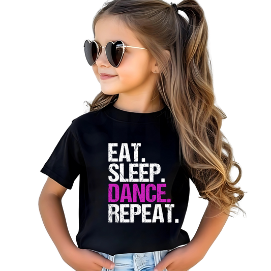 Child wearing a black t-shirt with 'EAT. SLEEP. DANCE. REPEAT.' text.
