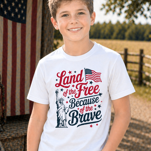 Child wearing a white t-shirt with patriotic design in front of an American flag.