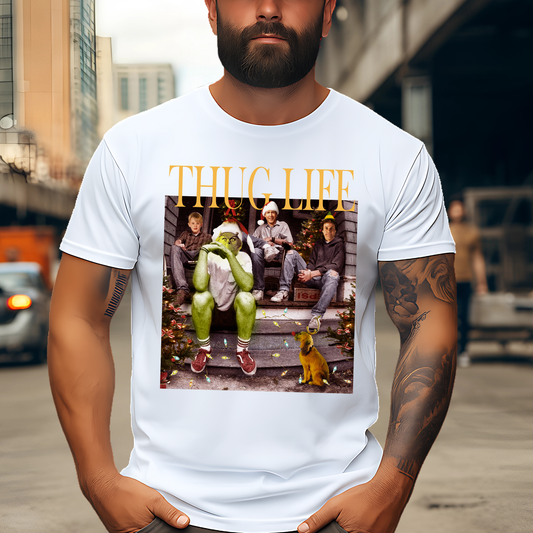 White unisex t-shirt featuring Hard Out Here for a Grinch graphic, casual indoor photo.