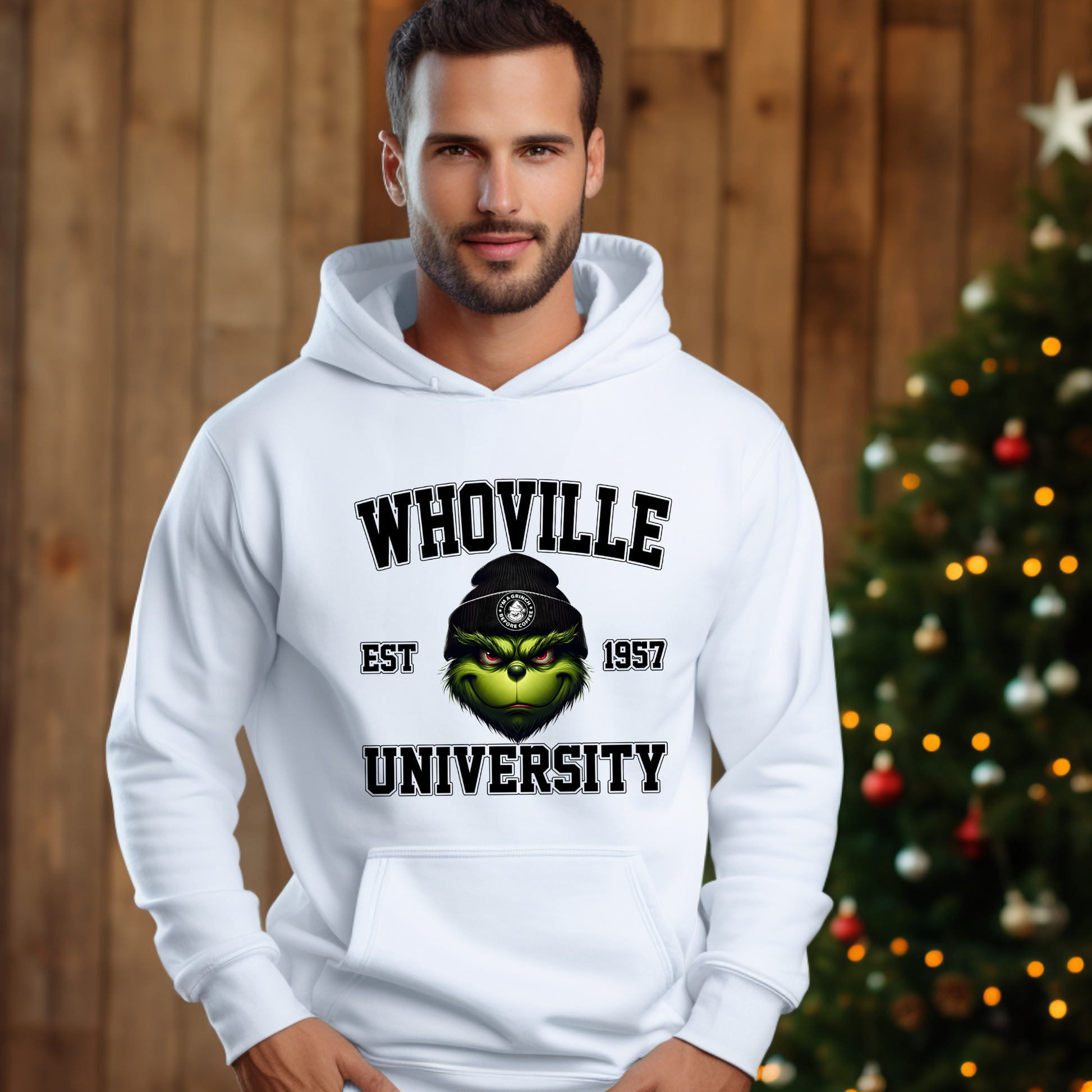 White unisex hoodie with Whoville University graphic, holiday background setting.