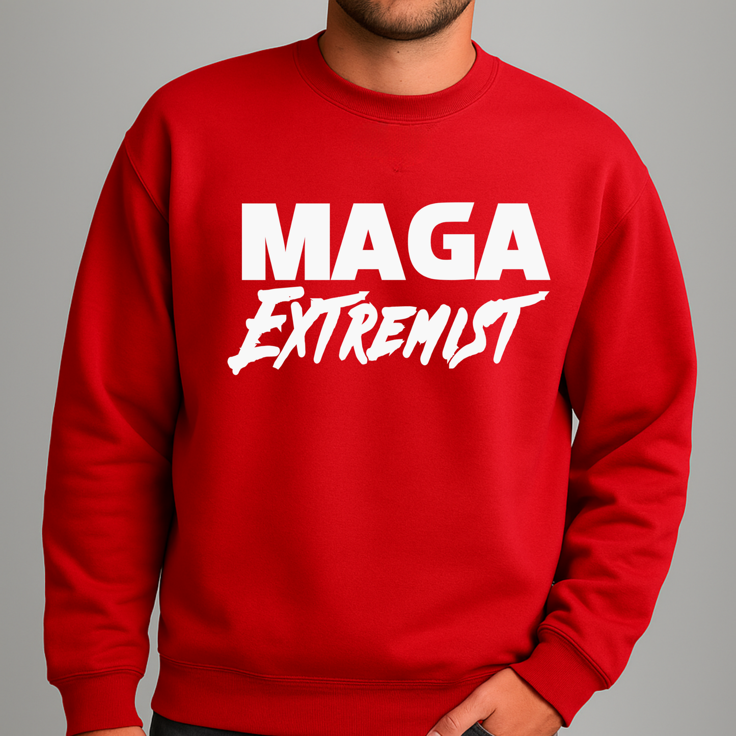 Close-up of MAGA Extremist text on men's red pullover sweatshirt