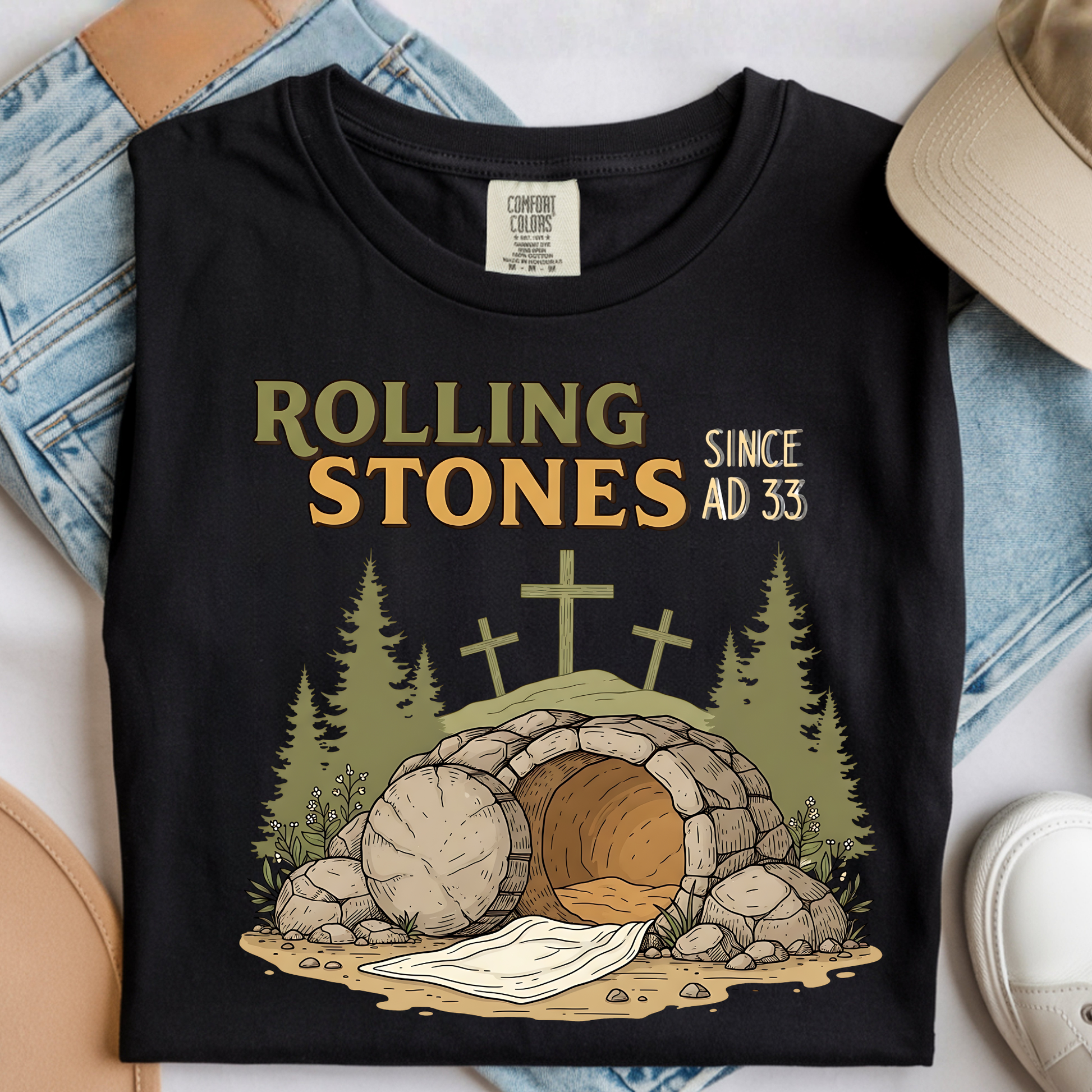 Comfort Colors black Christian graphic t-shirt with empty tomb design folded flat with denim and neutral accessories