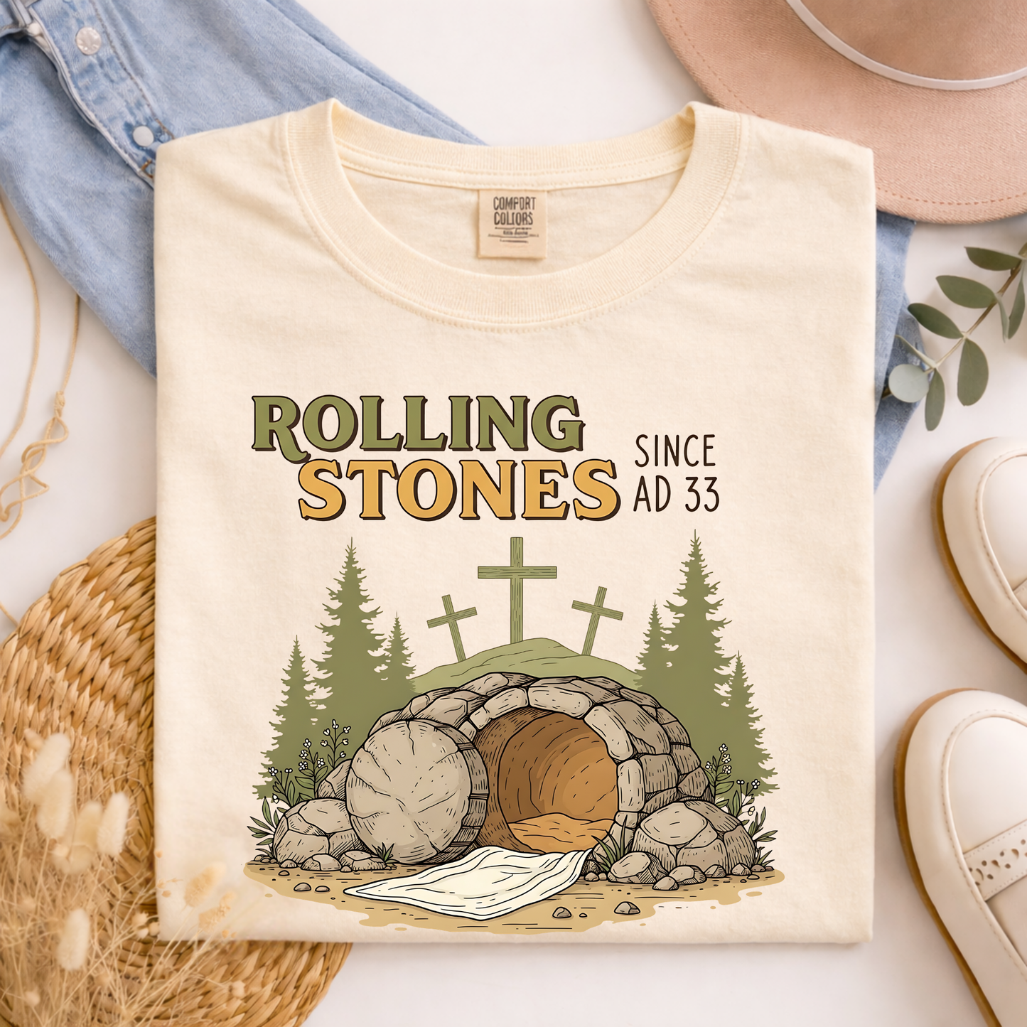 Comfort Colors ivory Christian graphic tee with empty tomb design folded with soft neutral styled background