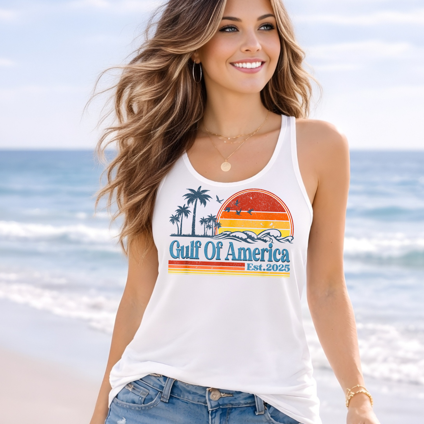 Woman wearing white Gulf of America tank top at the beach, patriotic summer graphic tank, coastal vacation outfit