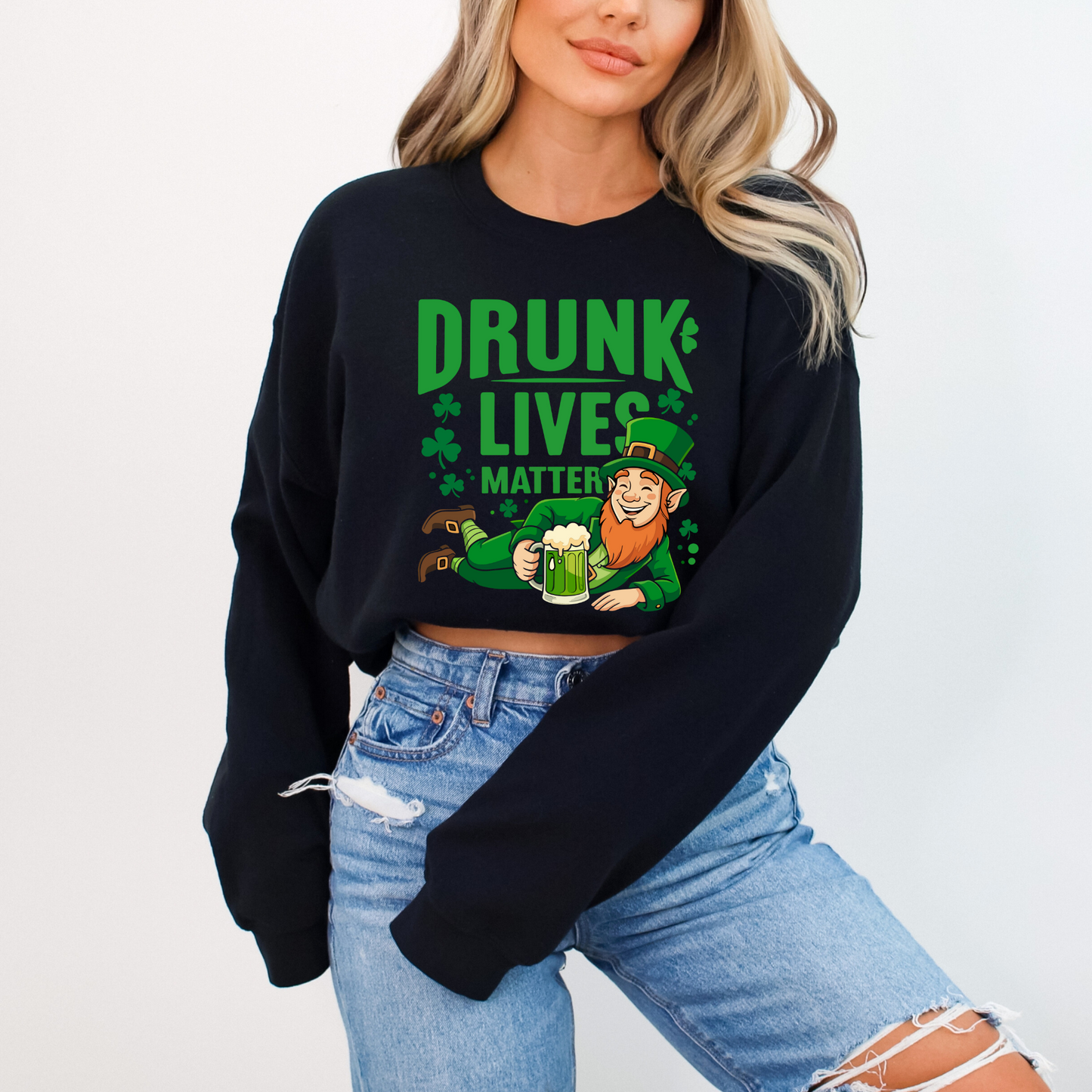 Woman modeling black “Drunk Lives Matter” sweatshirt with festive leprechaun and beer mug design for Irish holiday