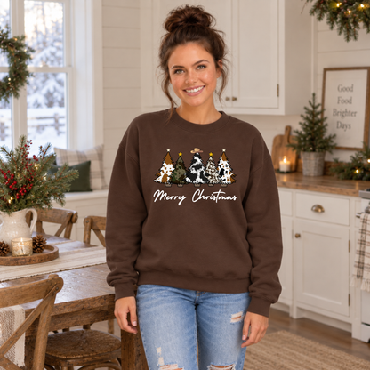 Woman wearing a brown Merry Christmas cow print trees sweatshirt in a holiday kitchen.