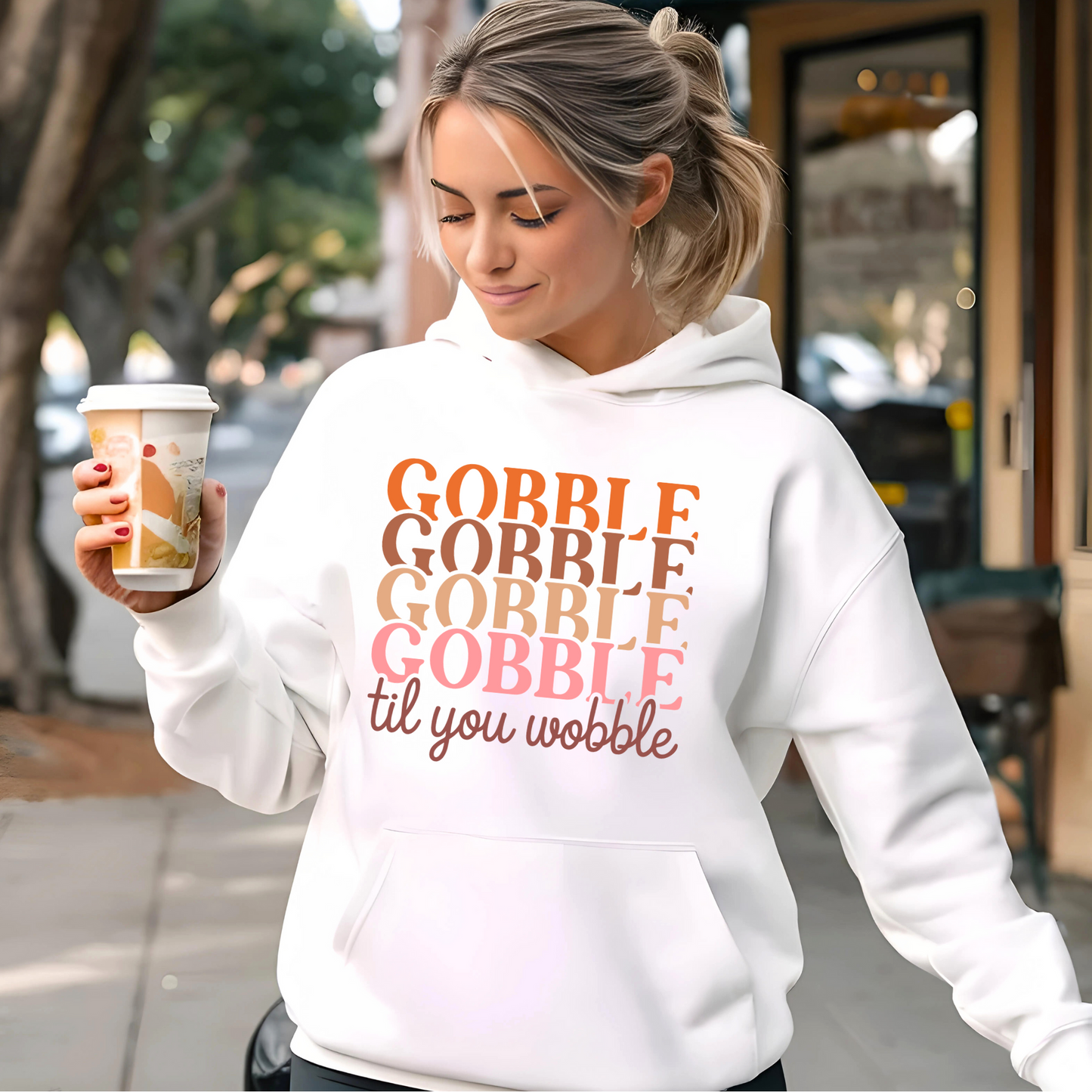 Cream hoodie with sunglasses and coffee – stylish fall outfit with Thanksgiving vibe
