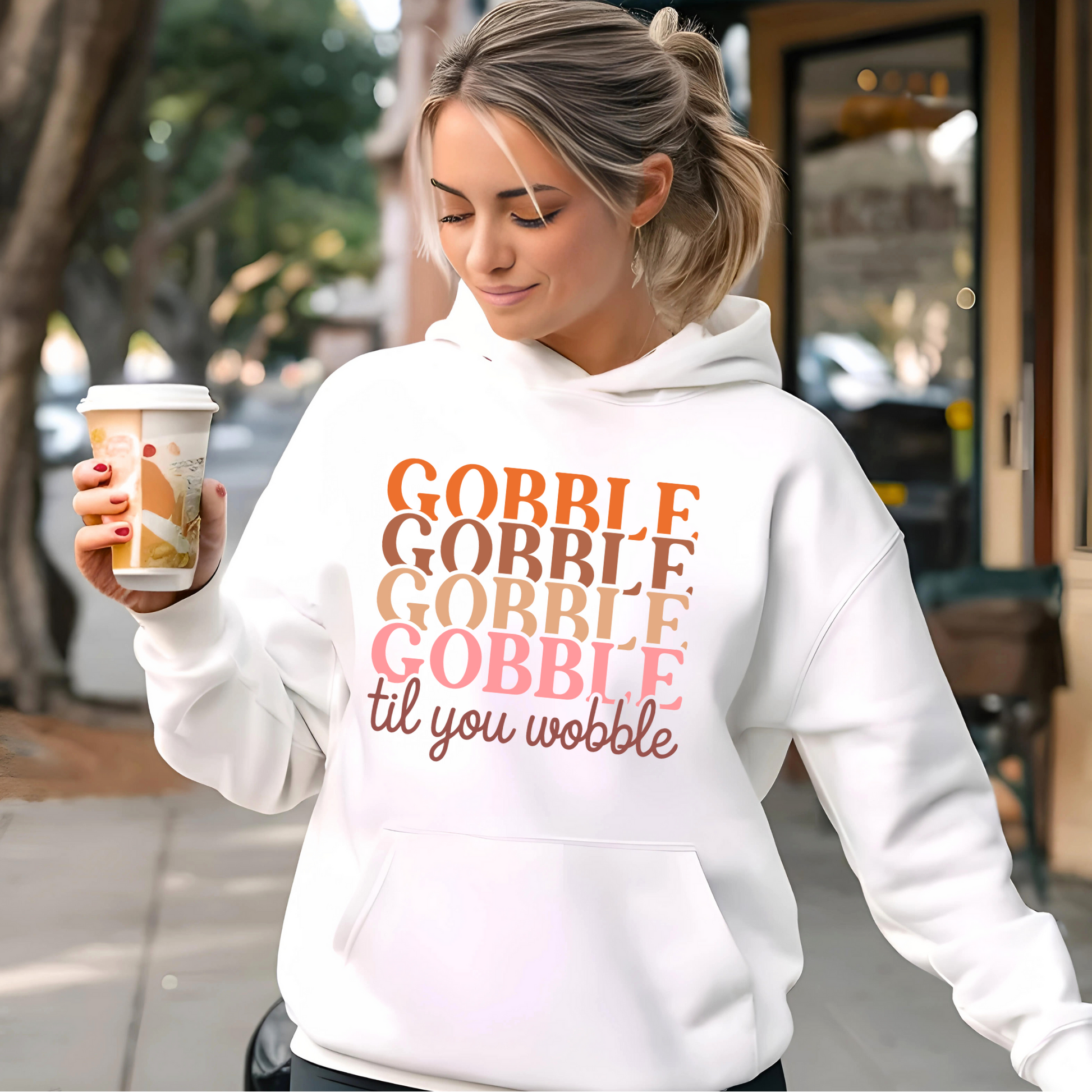 Cream hoodie with sunglasses and coffee – stylish fall outfit with Thanksgiving vibe
