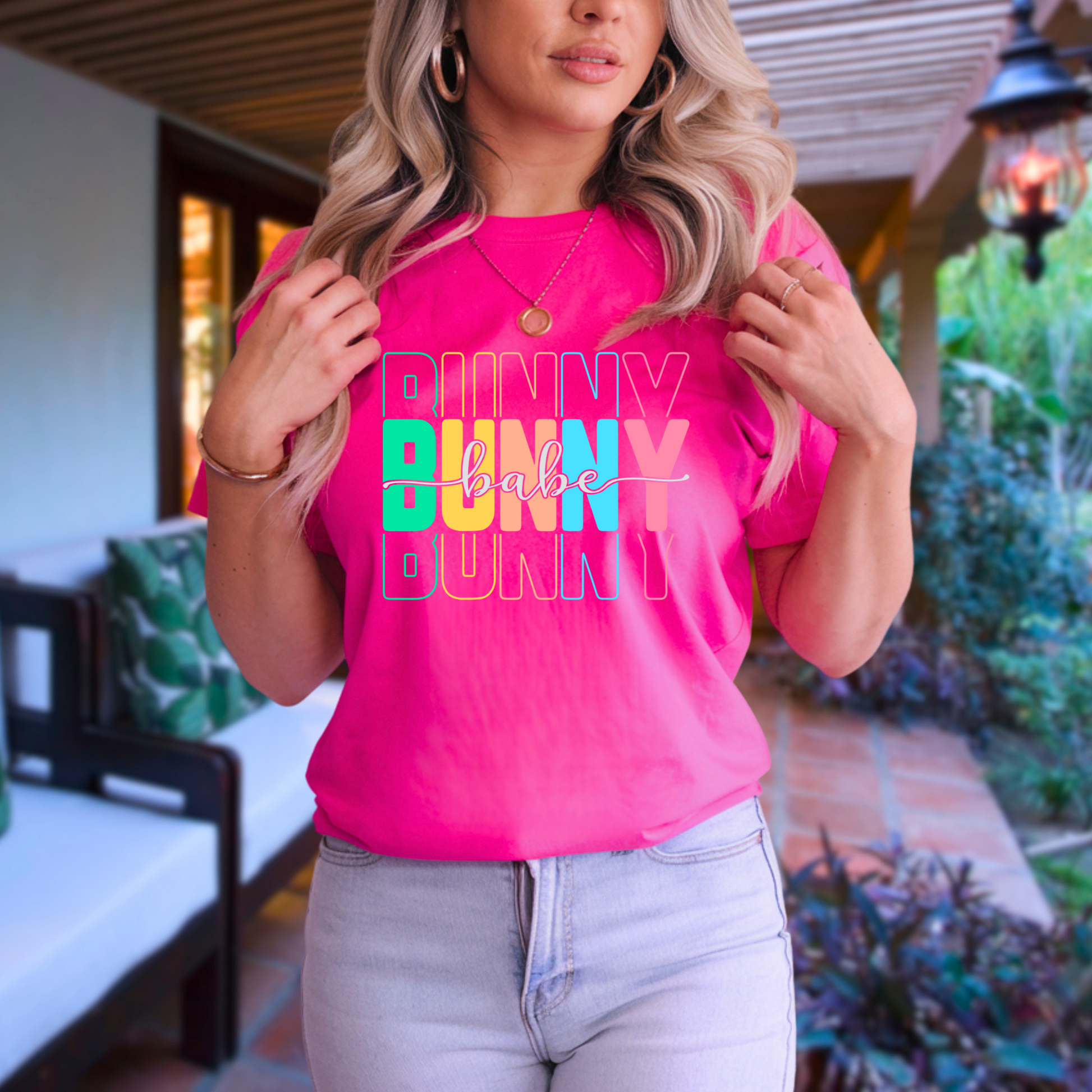 Trendy Bunny Babe graphic t-shirt with colorful pastel typography, perfect for Easter outfits, spring fashion, and casual wear. Soft cotton tee for women.