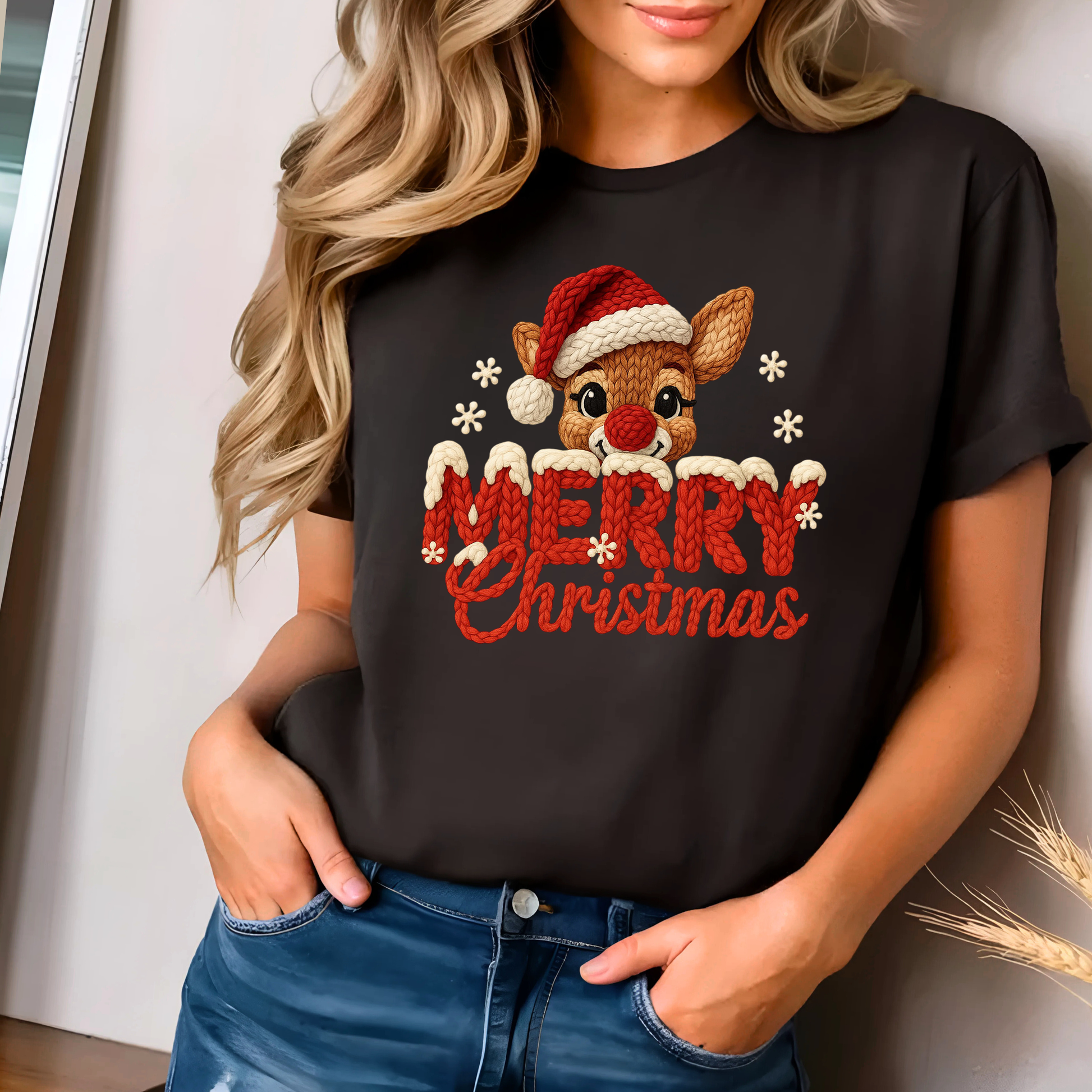 Dark brown T-shirt with faux crochet Merry Christmas reindeer design worn by woman indoors