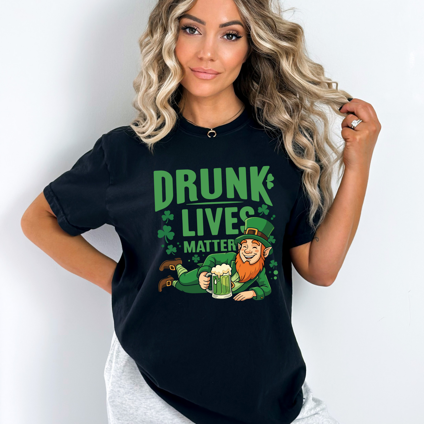 Woman wearing a black Drunk Lives Matter Tshirt with a leprechaun holding a beer mug