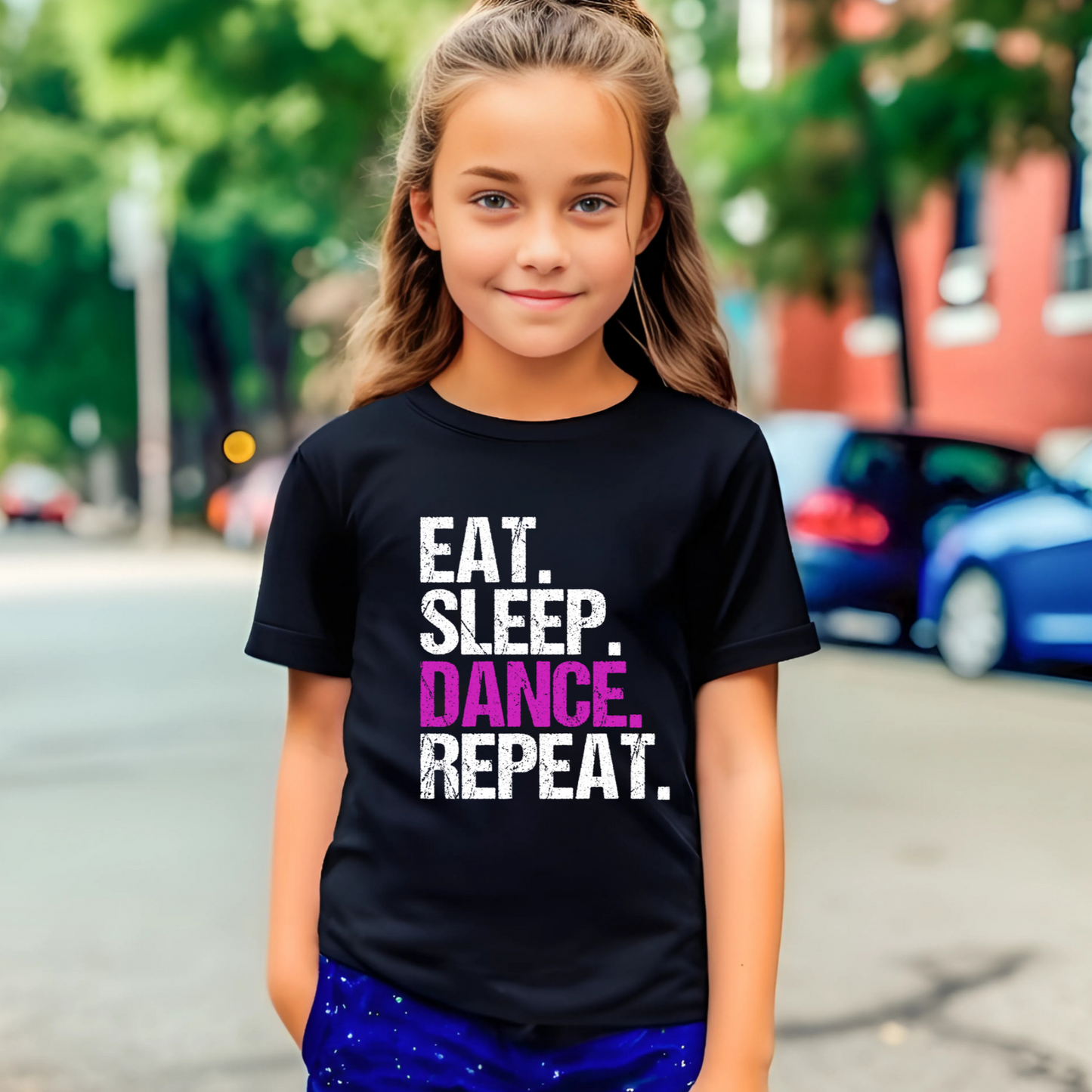 Dance all day in this trendy ‘Eat. Sleep. Dance. Repeat.’ T-shirt! Made for comfort and style, this tee is perfect for hip-hop, ballet, and jazz dancers. A must-have for any dance lover!