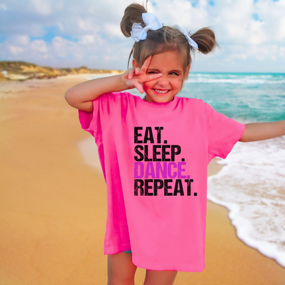 Dance all day in this trendy ‘Eat. Sleep. Dance. Repeat.’ T-shirt! Made for comfort and style, this tee is perfect for hip-hop, ballet, and jazz dancers. A must-have for any dance lover!