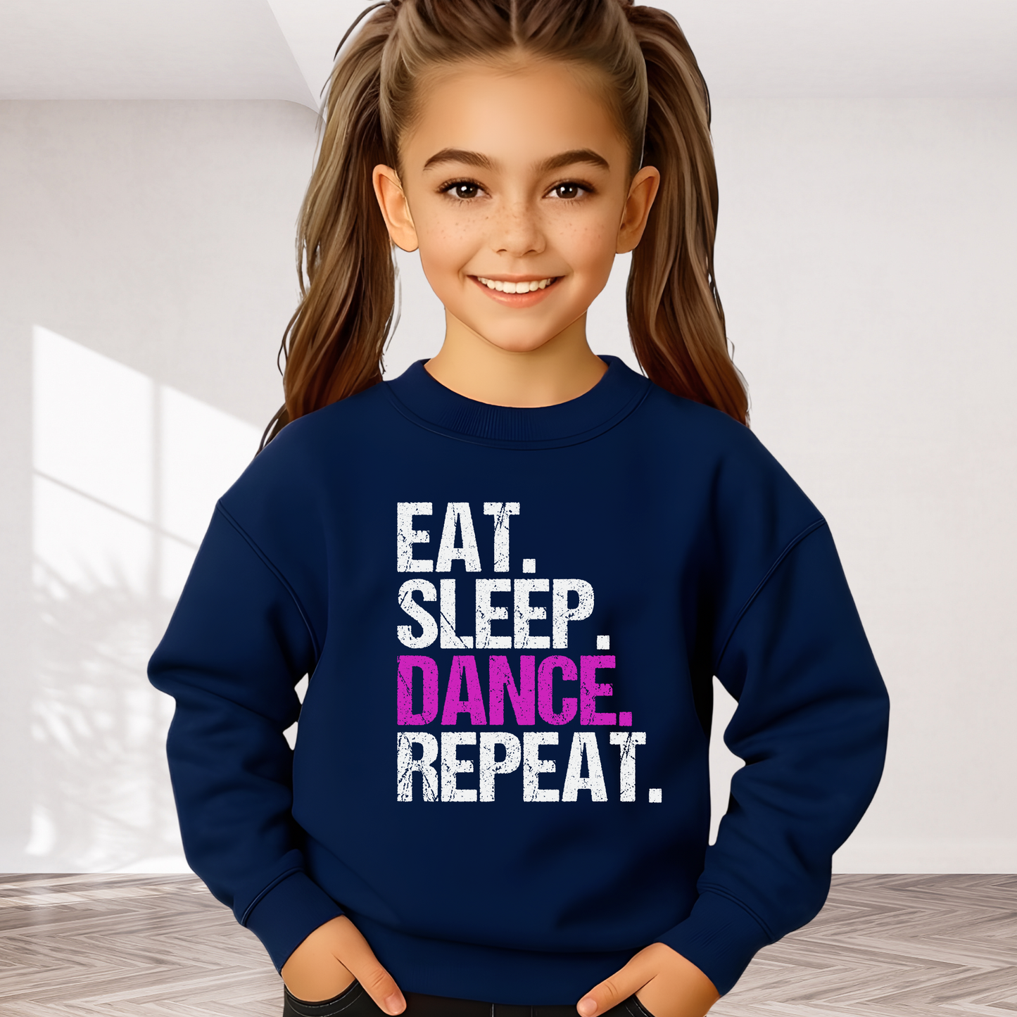 Girl wearing navy youth dance sweatshirt with distressed “Eat Sleep Dance Repeat” design, cozy dancer crewneck for kids.