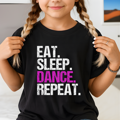 Girl wearing black youth dance t-shirt with “Eat Sleep Dance Repeat” graphic in pink and white, cute kids dance practice tee.