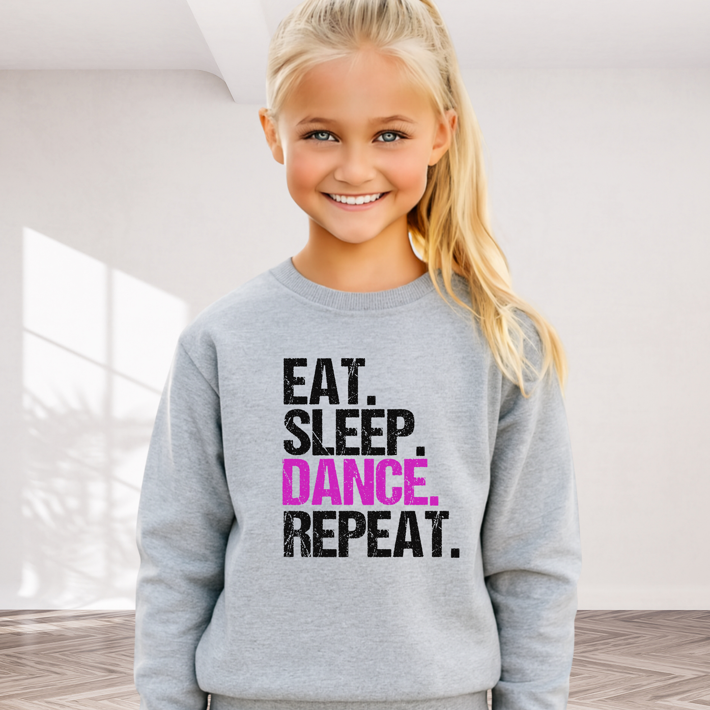 Girl wearing navy blue youth dance sweatshirt with bold graphic, comfy crewneck for dance practice or rehearsals.