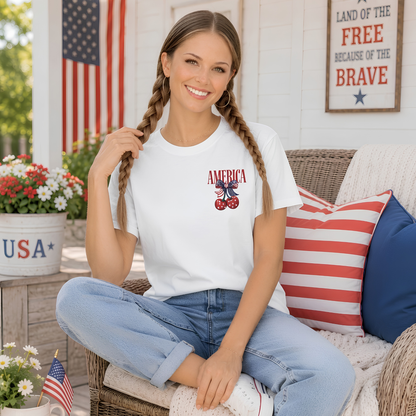 Woman wearing a white t-shirt with 'AMERICA' design sitting on a couch outdoors.