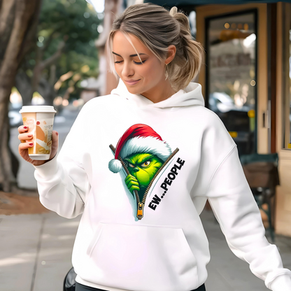 White hoodie with Ew People Christmas graphic worn outdoors with coffee.