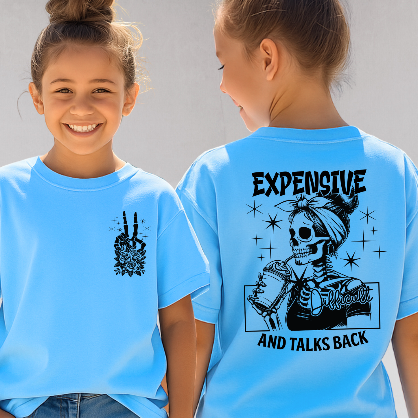 Girls in sky blue tee with "Expensive and Talks Back" skeleton design