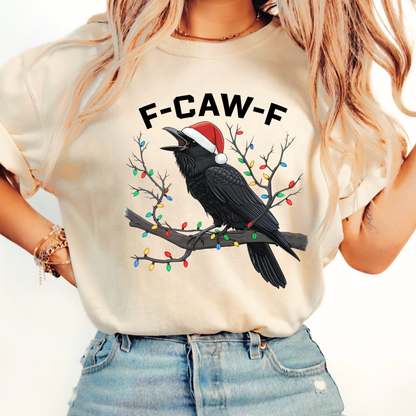 Woman in sand-colored funny Christmas shirt with raven and Santa hat.