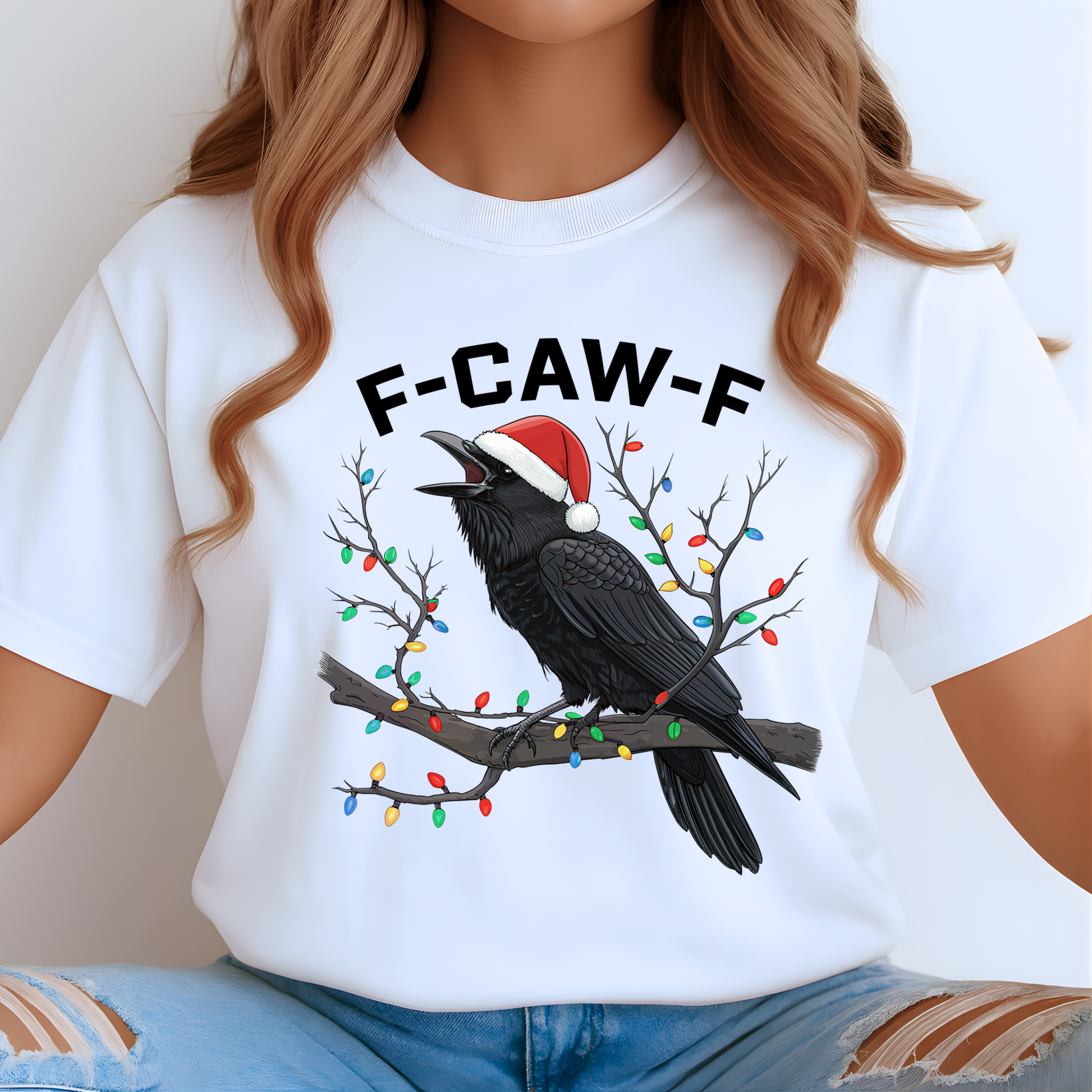 Woman in white funny raven holiday shirt featuring festive lights and Santa hat.
