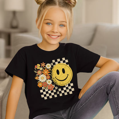 Youth girl wearing fall smiley face t-shirt with floral and checkerboard design
