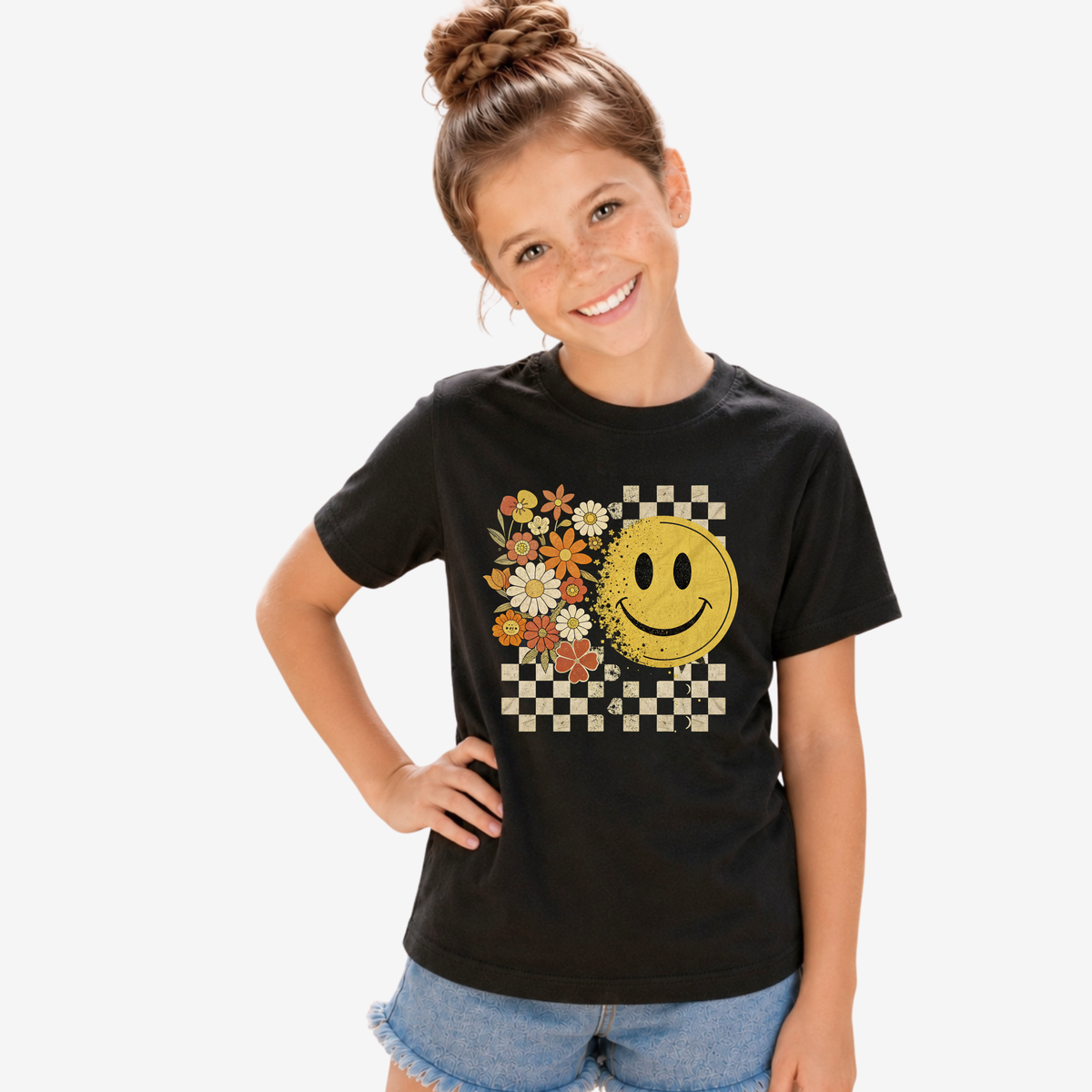 Youth black graphic T-shirt with floral smiley face and checkerboard design