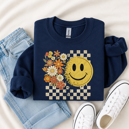 Navy youth sweatshirt flatlay with floral smiley face and checkerboard graphic