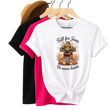 White t-shirt with 'Fall for Jesus' design on a hanger with black and pink shirts.