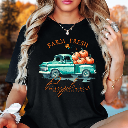 Woman in black "Farm Fresh Pumpkins" shirt styled with beanie for cozy fall look
