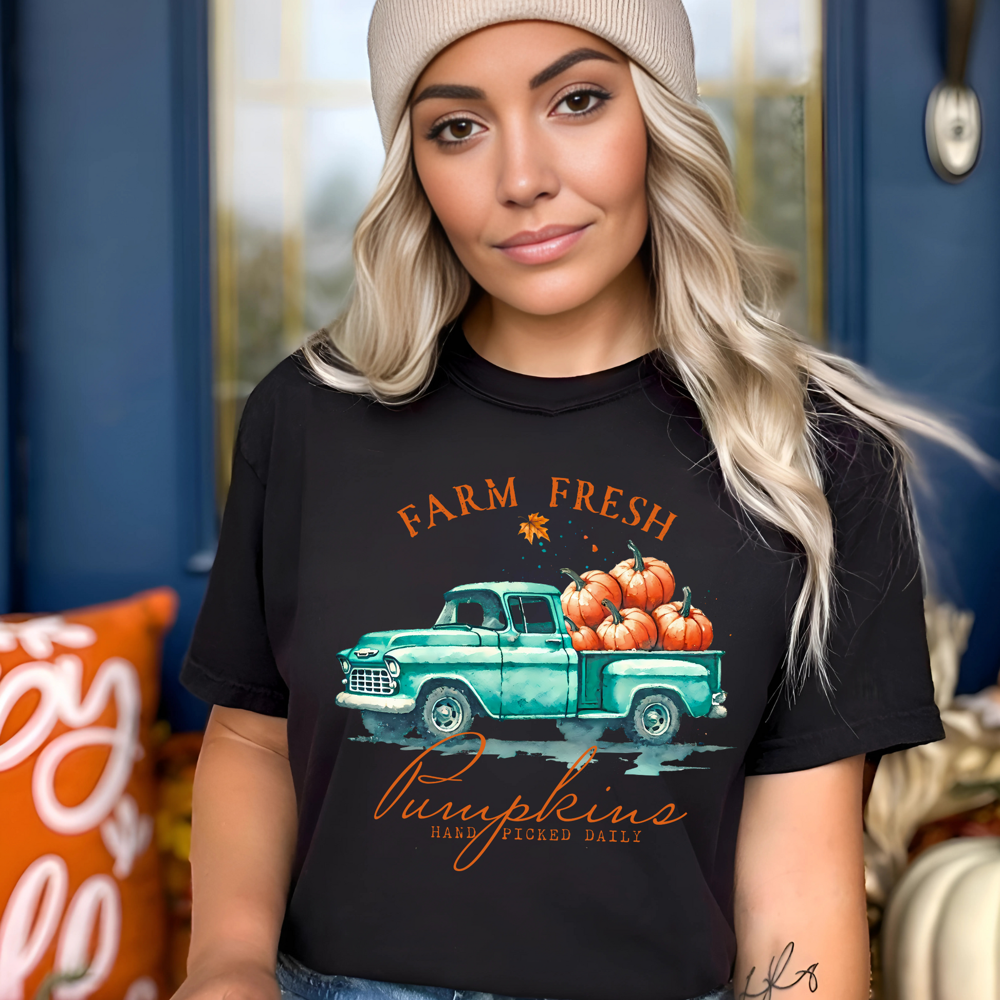 Woman in black "Farm Fresh Pumpkins" shirt styled with beanie for cozy fall look