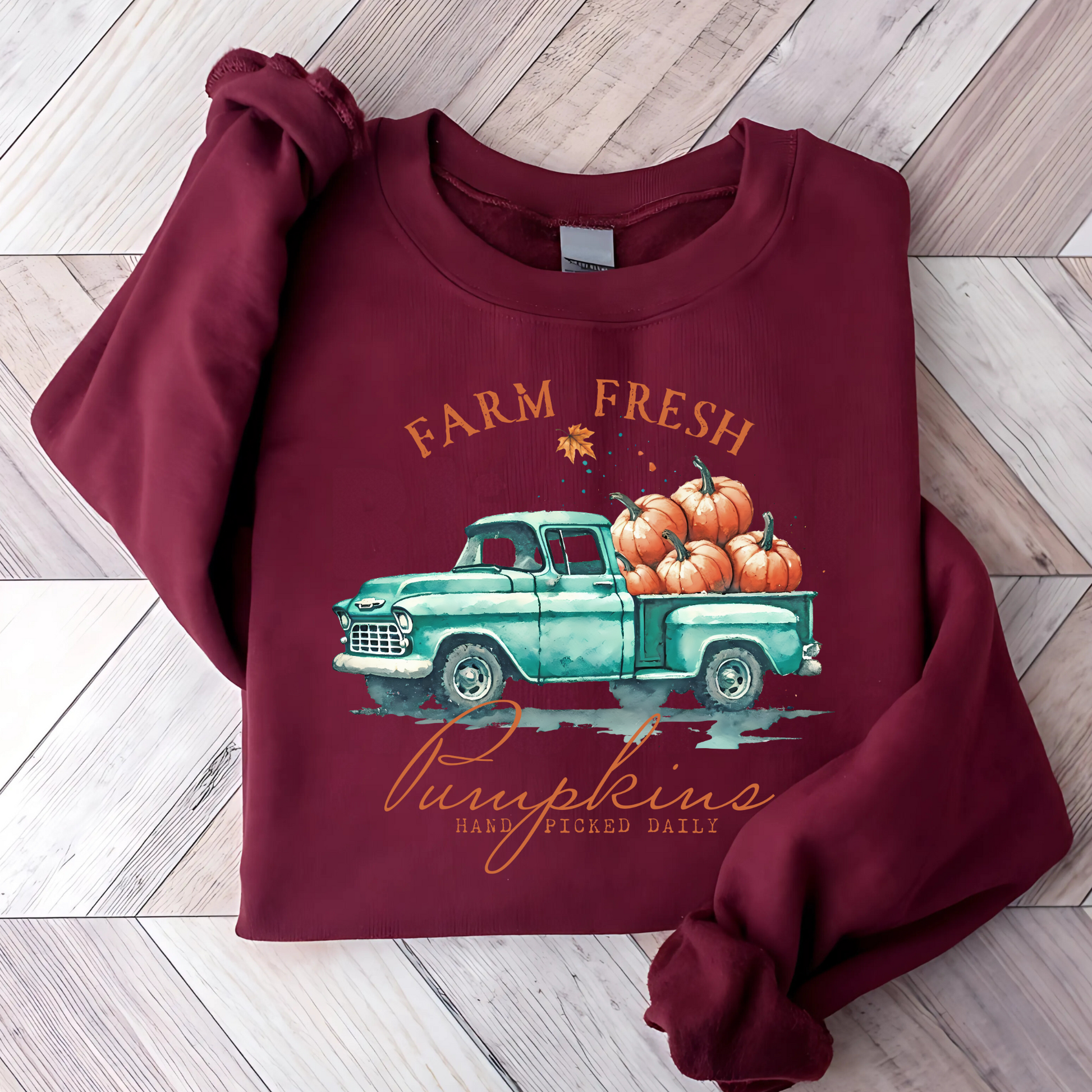 Maroon fall crewneck sweatshirt with pumpkin truck and rustic design
