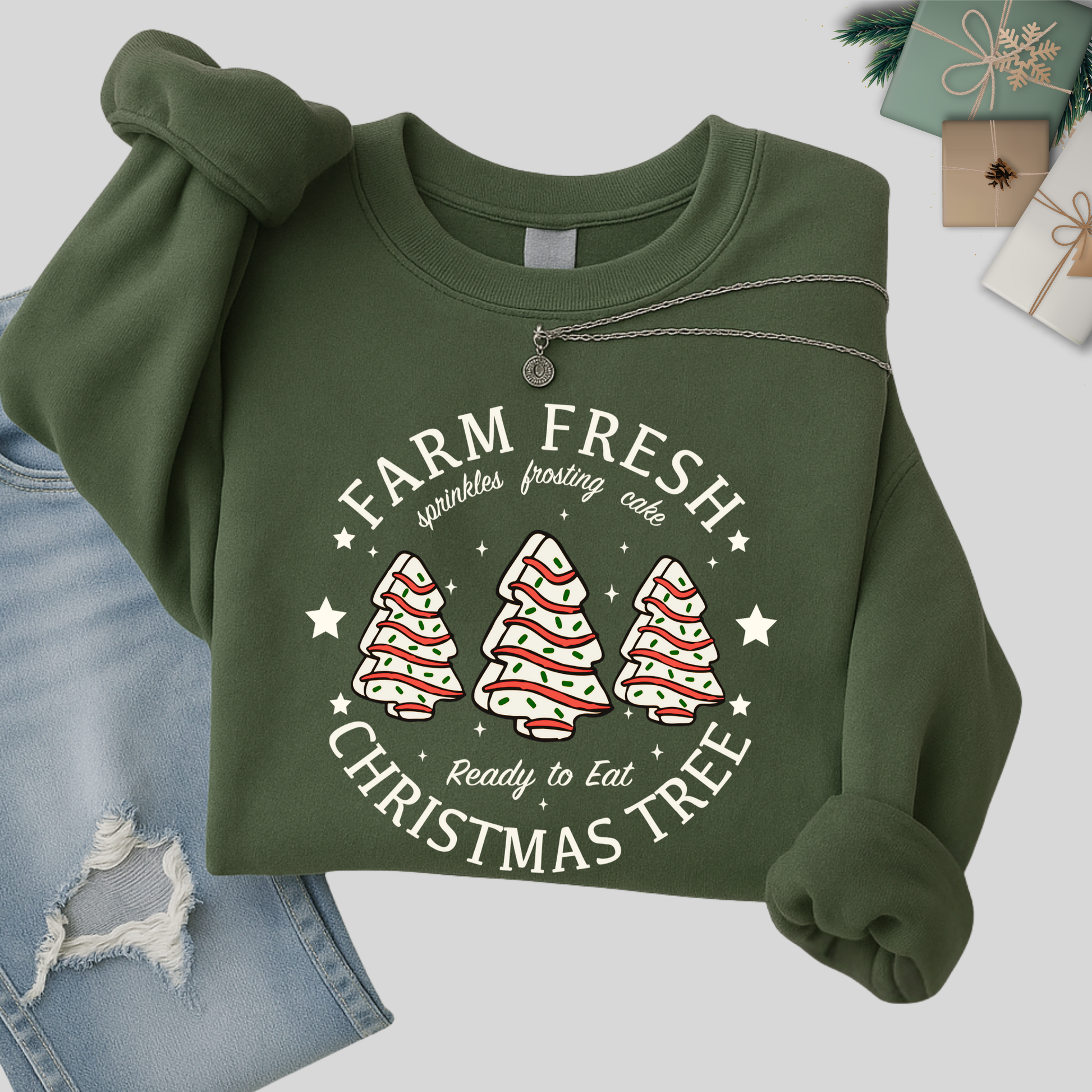 Green sweatshirt folded with holiday background