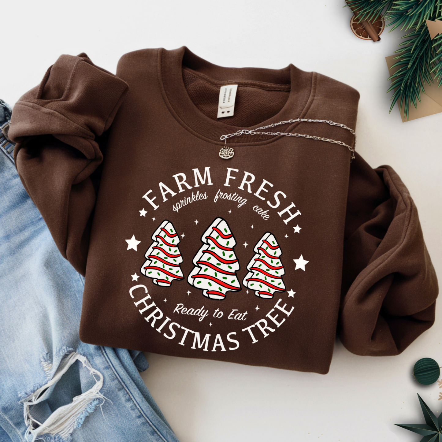 Brown Christmas sweatshirt flat lay with jeans