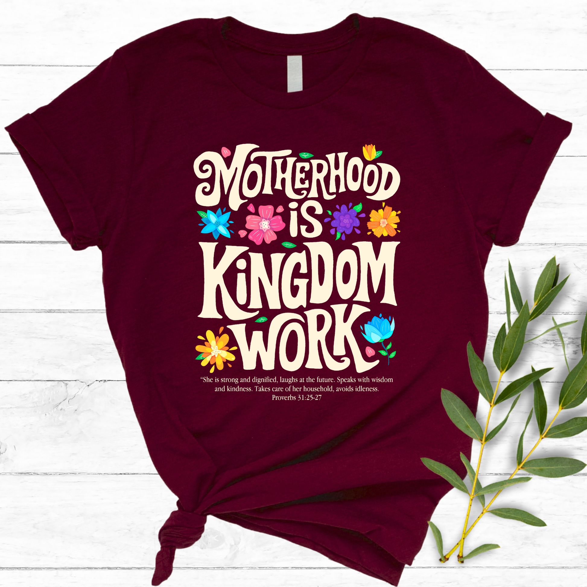 Flat lay maroon t-shirt with Christian motherhood quote