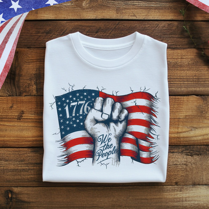 Folded 1776 shirt on rustic wood background with patriotic décor

