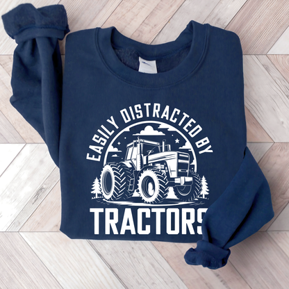 Folded navy Easily Distracted by Tractors sweatshirt flat lay