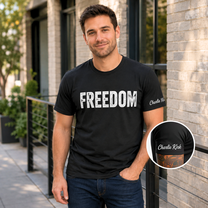 Man wearing a black FREEDOM T-shirt with Charlie Kirk signature printed on the inside sleeve, shown in a close-up inset.