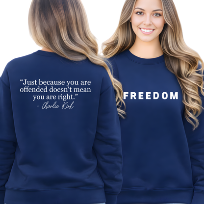 Woman wearing a Navy blue sweatshirt with 'FREEDOM' on front and quote on back, worn by a model.