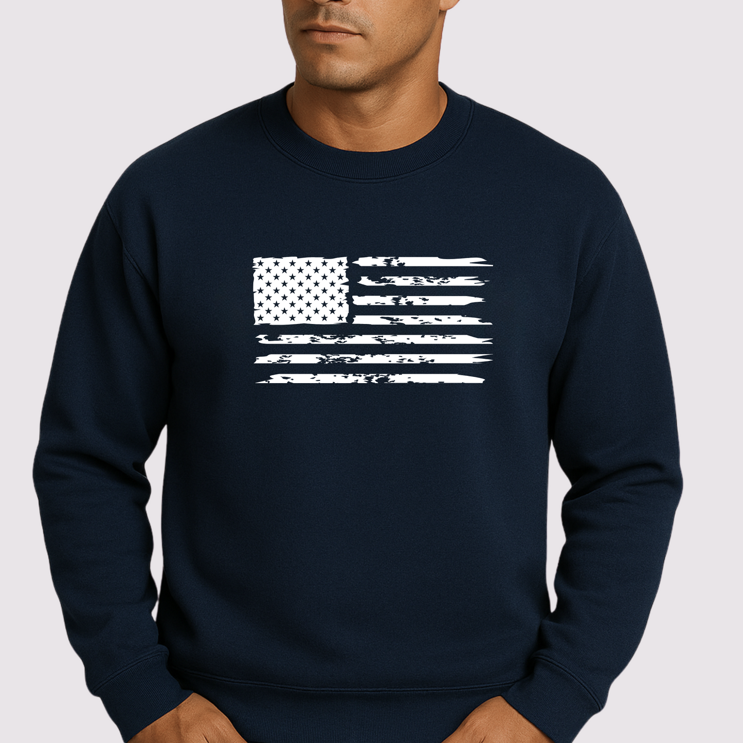 Navy blue sweatshirt with white American flag design worn by a person on a light gray background