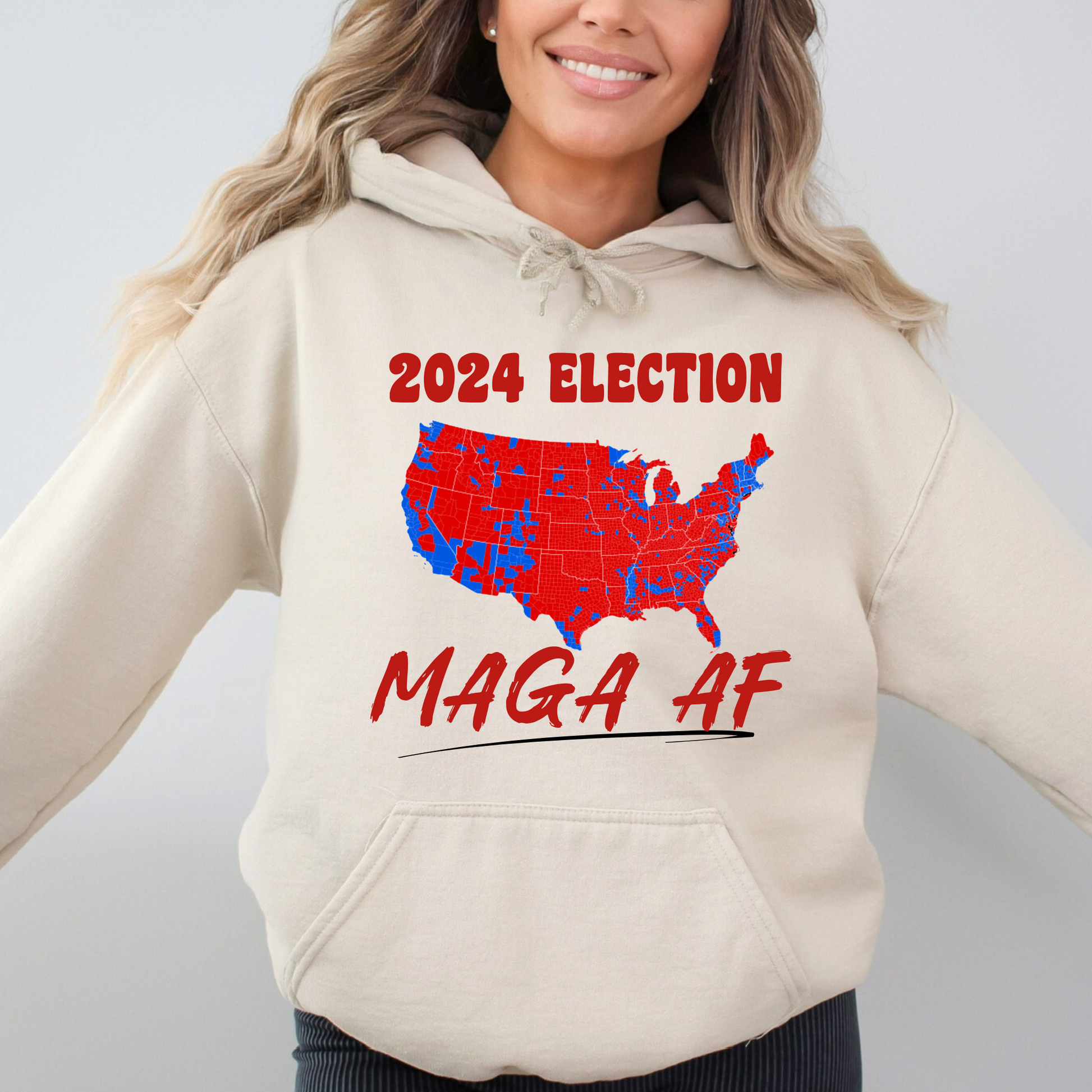 Front view of sand colored hoodie with bold USA map graphic in red and blue design