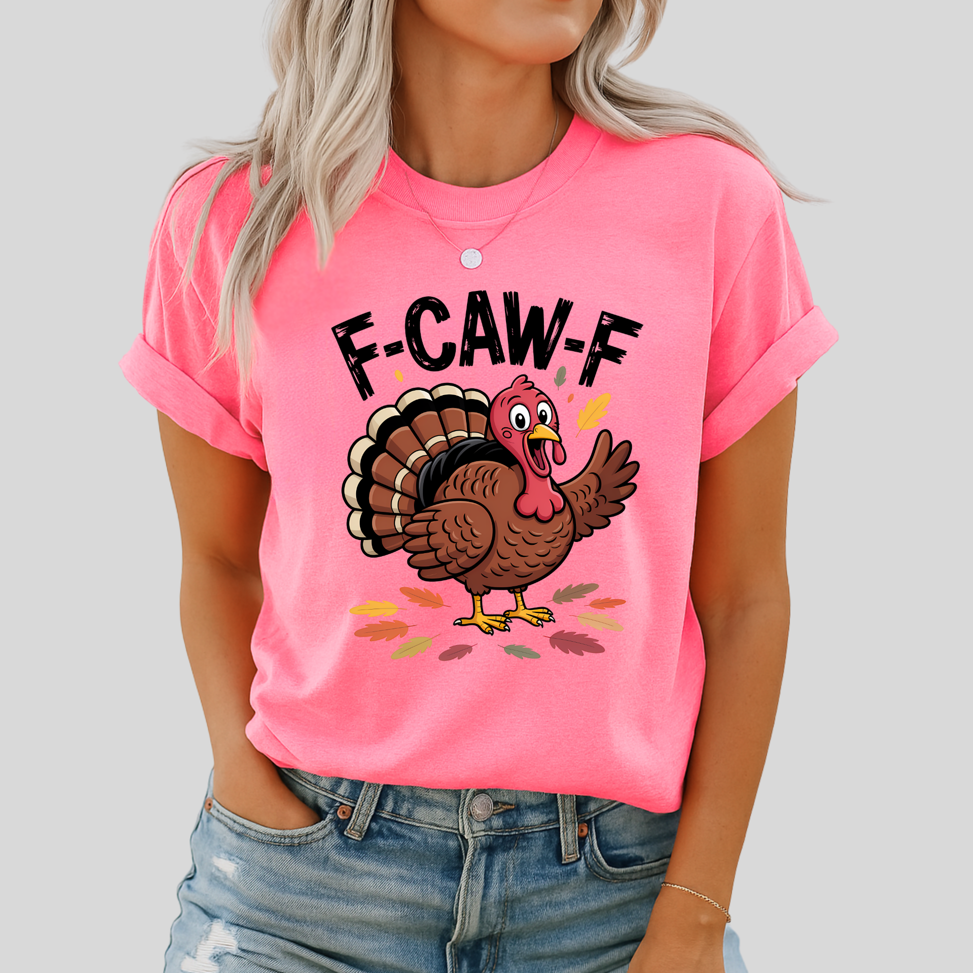 Woman wearing bright pink “F-CAW-F” turkey shirt and denim shorts