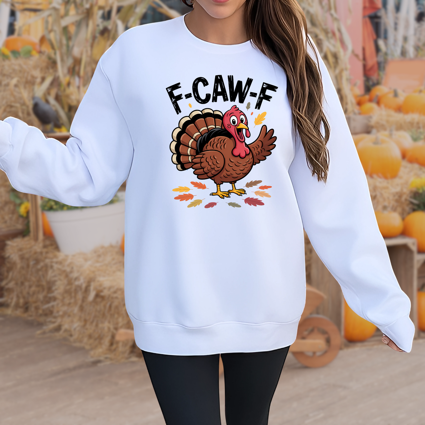 Woman wearing white F-CAW-F Thanksgiving sweatshirt outdoors