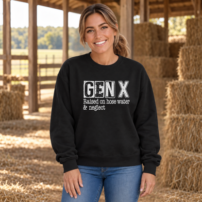 Woman wearing a black GEN X Raised on hose water & neglect sweatshirt beside hay bales in a barn.