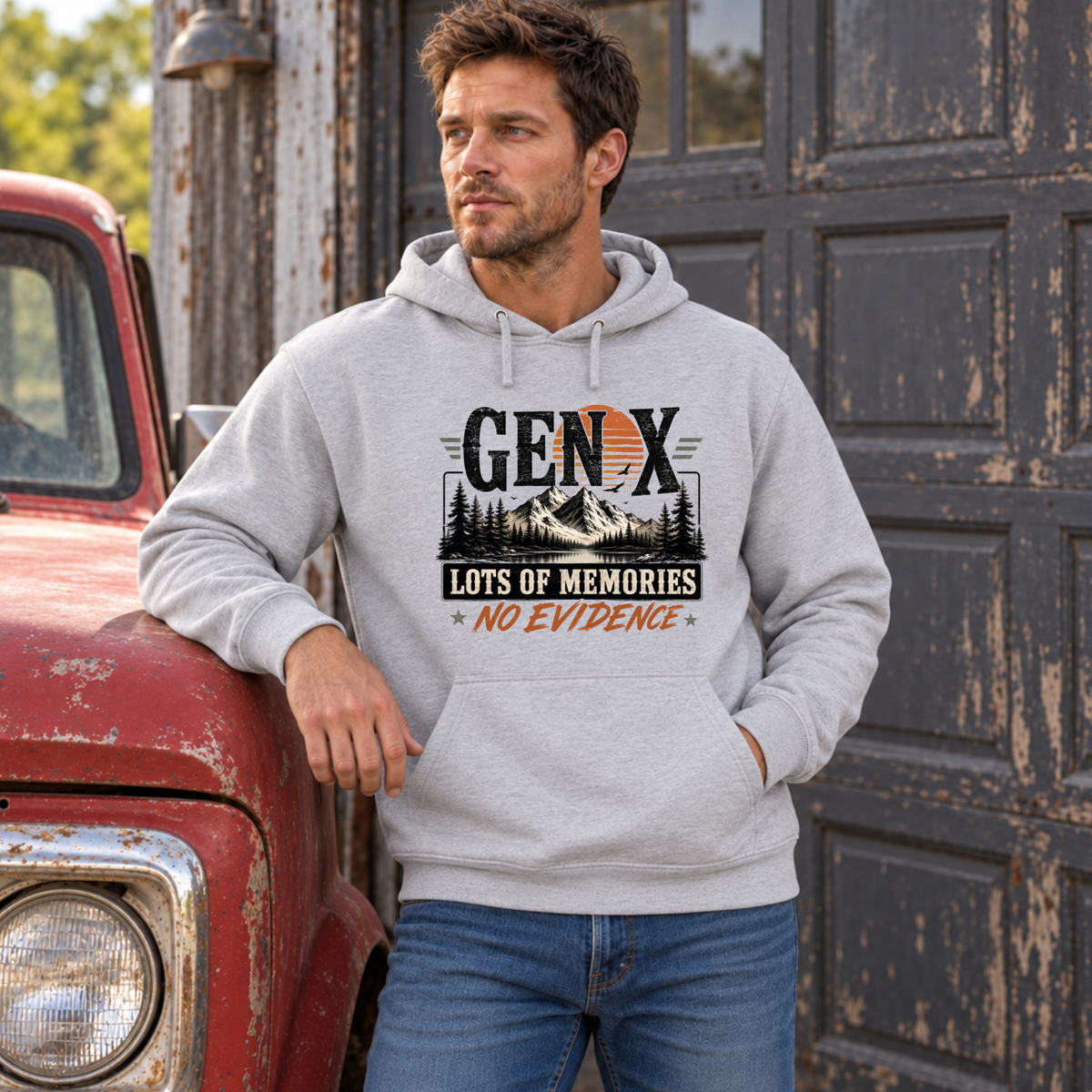 Men's sports gray Gen X hoodie with Lots of Memories No Evidence pine tree graphic, modeled leaning on a vintage red truck