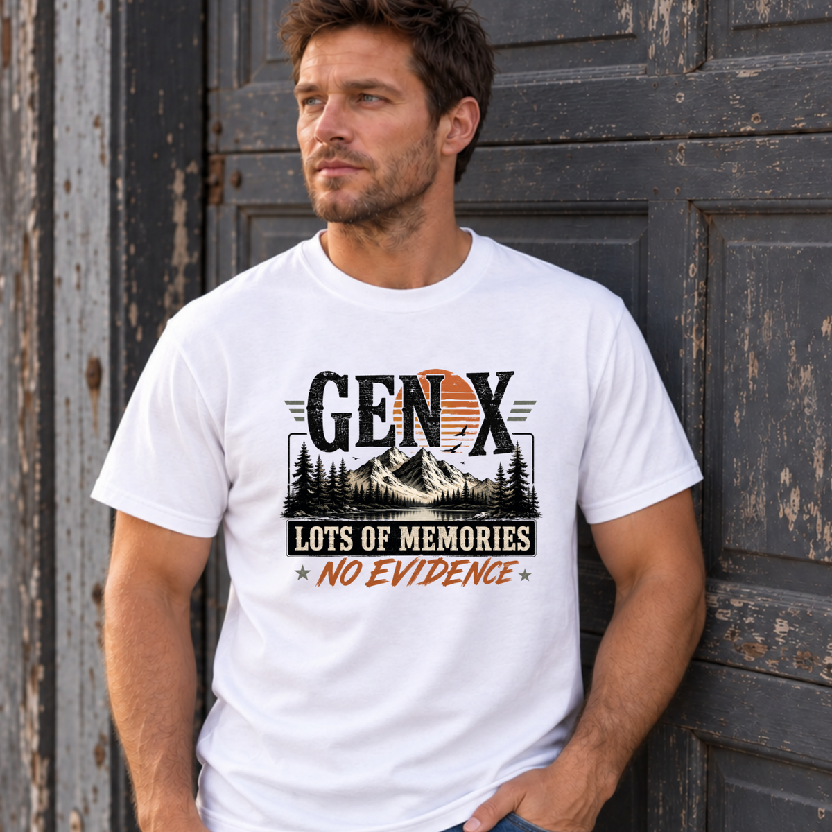 Men's white Gen X T-shirt with Lots of Memories No Evidence mountain and pine tree graphic, modeled against a weathered garage door