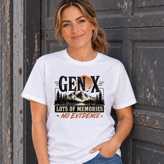 Women's white Gen X T-shirt with Lots of Memories No Evidence mountain and pine tree graphic, modeled against a weathered garage door