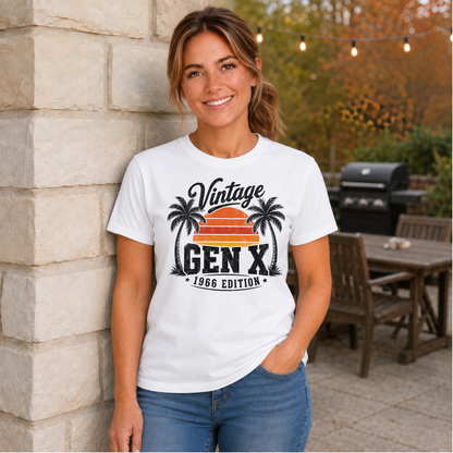 Woman wearing a white T-shirt with a Vintage Gen X 1966 Edition palm-tree sunset graphic in a fall patio setting.