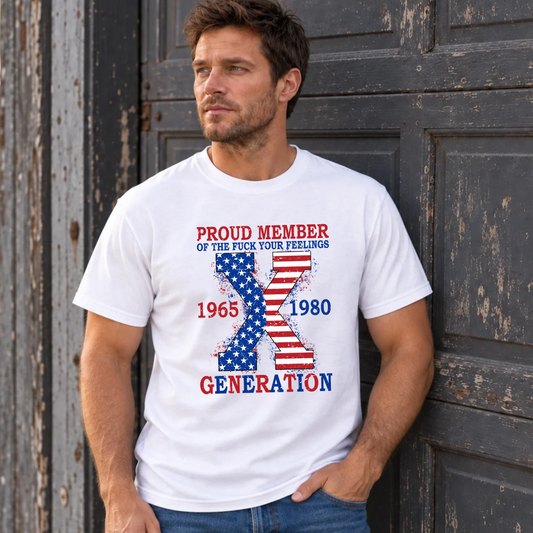 Men's white T-shirt with patriotic Generation X 1965–1980 American flag graphic, modeled against a weathered garage door